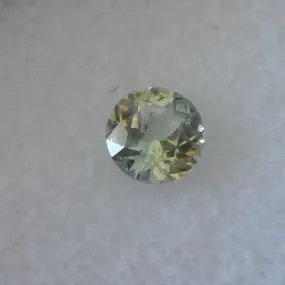 .65CTS. OLIVE GREEN WITH GOLDEN HIGHLIGHTS MONTANA SAPPHIRE